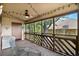 Relaxing screened porch with ceiling fan, string lights, and outdoor furniture to enjoy the outdoors at 223 Maison Dr. # B-8, Myrtle Beach, SC 29572