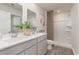 Well-lit bathroom featuring a double sink vanity, a large mirror, and a walk-in shower at 226 Carver Willow Dr., Loris, SC 29569