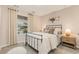 Bright bedroom featuring a window and comfortable bed with elegant animal wall decorations and soft lighting at 226 Carver Willow Dr., Loris, SC 29569