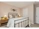 Cozy bedroom with a dark metal bed frame, decorative accents, and comfortable bedding at 226 Carver Willow Dr., Loris, SC 29569