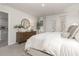 Bright bedroom featuring modern decor, a dresser, and a large comfortable bed with stylish bedding at 226 Carver Willow Dr., Loris, SC 29569