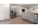 Modern kitchen with stainless steel refrigerator, ample cabinet space, and granite countertops at 226 Carver Willow Dr., Loris, SC 29569