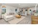 Open-concept living space with a cozy sofa, adjacent to the well-equipped kitchen and dining area at 226 Carver Willow Dr., Loris, SC 29569