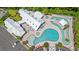 Stunning aerial view of the community pool and clubhouse, showcasing the layout and amenities at 229 Coral Beach Circle, Surfside Beach, SC 29575