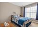 Cozy bedroom featuring a comfortable bed with a decorative quilt and a sunny window at 229 Coral Beach Circle, Surfside Beach, SC 29575
