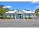 Charming community clubhouse with a white roof, offering a welcoming space for residents and guests to gather at 229 Coral Beach Circle, Surfside Beach, SC 29575