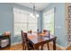 Charming dining area with hardwood floors, ample natural light, and a stylish chandelier fixture at 229 Coral Beach Circle, Surfside Beach, SC 29575