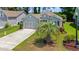 Charming home featuring a well-maintained lawn and a beautiful palm tree at 229 Coral Beach Circle, Surfside Beach, SC 29575