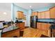 Well-equipped kitchen featuring granite countertops, stainless steel appliances, and wood cabinetry at 229 Coral Beach Circle, Surfside Beach, SC 29575