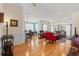 Bright and airy living room showcasing hardwood floors, an open layout, and seamless flow to dining area at 229 Coral Beach Circle, Surfside Beach, SC 29575