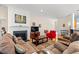 Cozy living room with a fireplace, wainscotting, hardwood floors, and comfortable seating, perfect for relaxation at 229 Coral Beach Circle, Surfside Beach, SC 29575