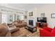 Inviting living room featuring a fireplace, plush seating, and French doors leading to the outdoors at 229 Coral Beach Circle, Surfside Beach, SC 29575