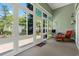 Relaxing sunroom featuring large windows with backyard views, a comfortable seating area, and lots of light at 229 Coral Beach Circle, Surfside Beach, SC 29575