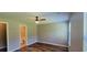 Bedroom featuring ceiling fan, window, neutral walls, and access to a bathroom at 2407 James St. # 401, Conway, SC 29527