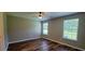 Inviting bedroom features two windows, ceiling fan, and neutral wall paint at 2407 James St. # 401, Conway, SC 29527