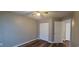 Neutral bedroom featuring dark wood flooring, a ceiling fan, and closet at 2407 James St. # 401, Conway, SC 29527