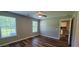 Comfortable bedroom features neutral walls, two windows, ceiling fan, and attractive flooring at 2407 James St. # 401, Conway, SC 29527