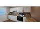 Well-equipped kitchen featuring granite countertops, white cabinets, and appliances at 2407 James St. # 401, Conway, SC 29527