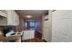 Well-equipped kitchen with white cabinets and appliances, overlooking a spacious living area at 2407 James St. # 401, Conway, SC 29527