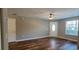 Spacious living room with ample natural light, ceiling fan, and wood-look floors at 2407 James St. # 401, Conway, SC 29527