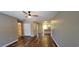 Well-lit living room featuring wood-look floors and views into the bathroom and kitchen at 2407 James St. # 401, Conway, SC 29527