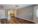 Spacious living room with hardwood floors, ceiling fan, and open access to kitchen at 2407 James St. # 401, Conway, SC 29527