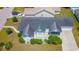 Aerial view of a home with a screened-in porch, large driveway, and well-maintained landscaping at 2499 Burning Tree Ln., Little River, SC 29566
