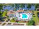 Community pool offers a refreshing oasis, surrounded by lush landscaping and ample seating at 2499 Burning Tree Ln., Little River, SC 29566