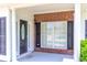 Welcoming front porch featuring brick accents and a stylish front door at 2499 Burning Tree Ln., Little River, SC 29566