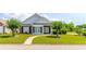 Lovely home with brick accents, manicured landscaping and winding walkway at 2499 Burning Tree Ln., Little River, SC 29566