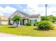Charming one-story home with lush green lawn and manicured landscaping at 2499 Burning Tree Ln., Little River, SC 29566
