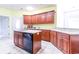 Spacious kitchen with island, white countertops and black appliances at 2499 Burning Tree Ln., Little River, SC 29566