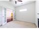 Open living area with fireplace, French doors, neutral carpet and bright natural light at 2499 Burning Tree Ln., Little River, SC 29566