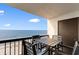 Relax on the balcony with seating and a view of the beautiful ocean and beach at 2609 South Ocean Blvd. # 702, North Myrtle Beach, SC 29582