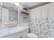 Well-lit bathroom featuring marble vanity top and patterned shower curtain at 2609 South Ocean Blvd. # 702, North Myrtle Beach, SC 29582