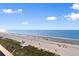 Panoramic beach view showcasing sand, sea, and blue sky on a sunny day at 2609 South Ocean Blvd. # 702, North Myrtle Beach, SC 29582