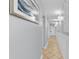 Long hallway features neutral paint, baseboards, and picture frame molding plus decorative lighting and tiled floors at 2609 South Ocean Blvd. # 702, North Myrtle Beach, SC 29582