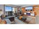 Open living room featuring modern furniture, stylish decor, sliding glass door access to the outdoor patio, and a view at 2609 South Ocean Blvd. # 702, North Myrtle Beach, SC 29582