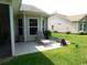 Backyard featuring a patio, lounge chair, potted flowers, and a frog statue at 266 Tall Palms Way, Little River, SC 29566