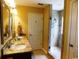 Modern bathroom with double sinks, granite countertops, and a glass-enclosed shower at 266 Tall Palms Way, Little River, SC 29566