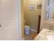 Small bathroom with a toilet, sink with granite countertop, and tiled floor at 266 Tall Palms Way, Little River, SC 29566