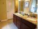 Bathroom vanity features a double sink with granite countertop and tile flooring at 266 Tall Palms Way, Little River, SC 29566