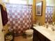 Inviting bathroom with a shower-tub combo, neutral walls, and ample lighting at 266 Tall Palms Way, Little River, SC 29566