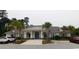 Community clubhouse featuring a welcoming entrance and ample parking at 266 Tall Palms Way, Little River, SC 29566