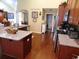 Modern kitchen with granite countertops, stainless steel appliances, and a functional island at 266 Tall Palms Way, Little River, SC 29566