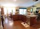 Well-equipped kitchen with granite island, stainless steel appliances, and open access to dining area at 266 Tall Palms Way, Little River, SC 29566