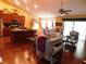 Spacious living room with hardwood floors, vaulted ceilings, and abundant natural light at 266 Tall Palms Way, Little River, SC 29566