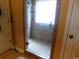 Bathroom shower with glass door and tiled walls at 266 Tall Palms Way, Little River, SC 29566