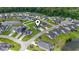 A neighborhood with well-maintained lawns, sidewalks, and streets in a lush green environment at 282 Foxpath Loop, Myrtle Beach, SC 29588