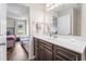 Bathroom with a dark wood vanity, white countertops and a view of the bedroom at 282 Foxpath Loop, Myrtle Beach, SC 29588